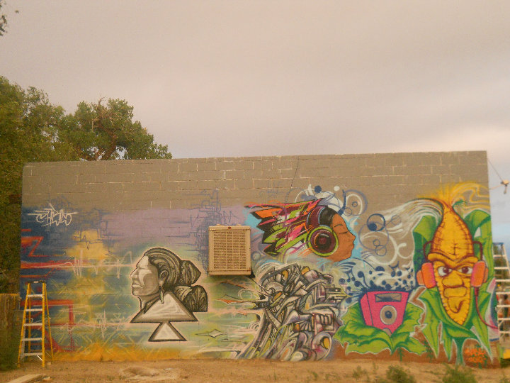 Graffiti workshop Mural for Rethink Dine' Power in Shiprock, New Mexico From the left Phobs, JCBL and myself rockin the cobman! Click the pic to see more...
